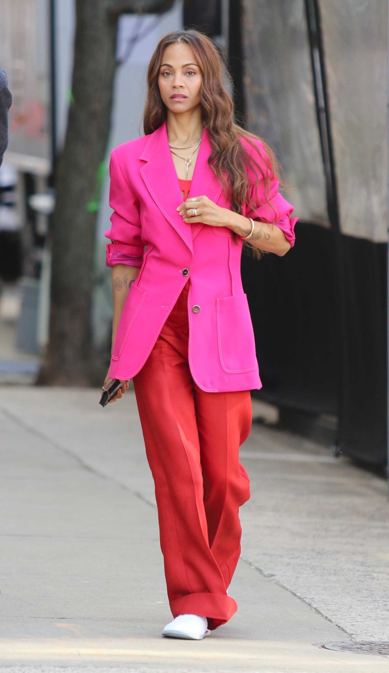 Zoe Saldana in a Pink Blazer while Filming a Stella Artois Beer