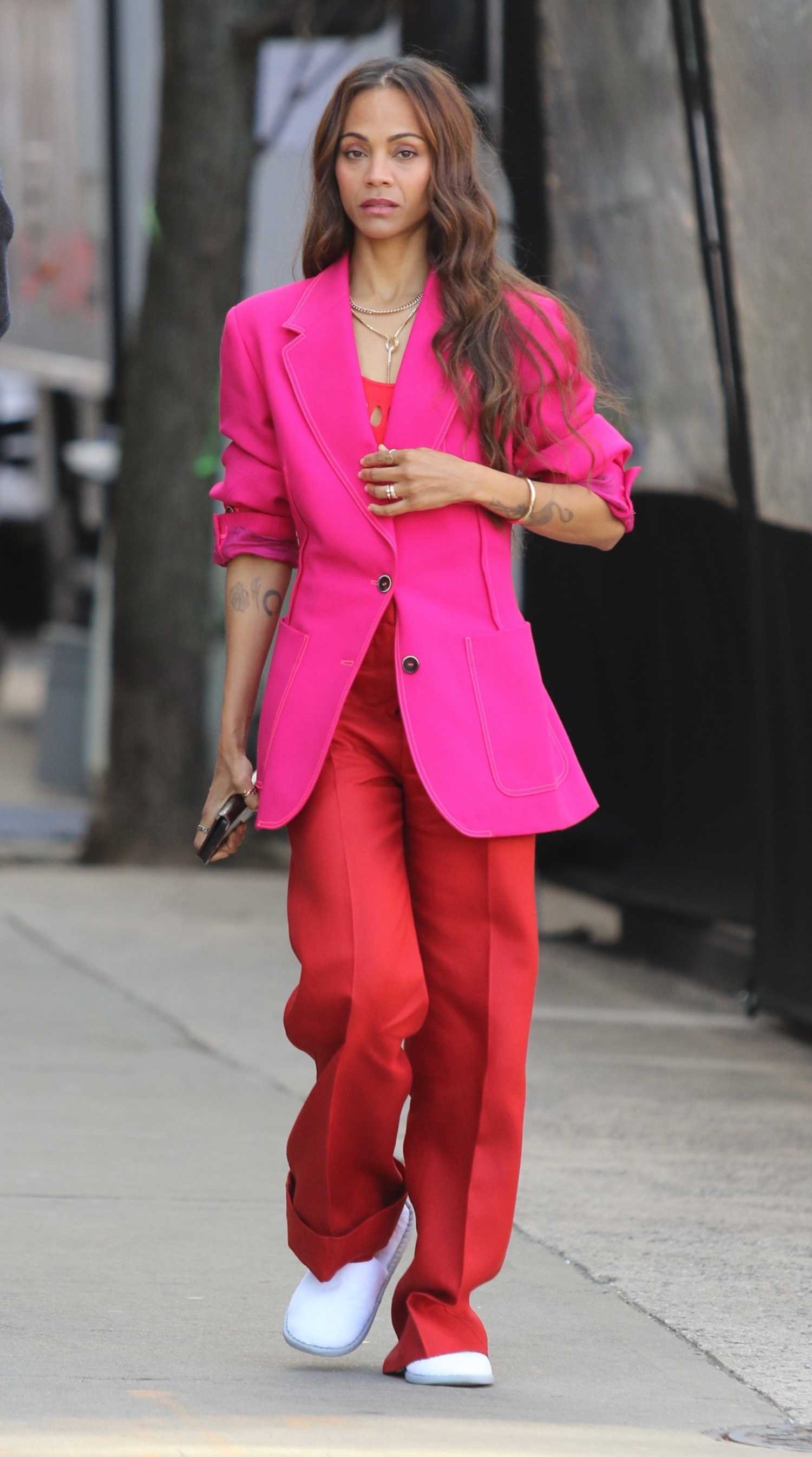 Zoe Saldana in a Pink Blazer while Filming a Stella Artois Beer