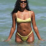 Gabrielle Union in a Yellow Bikini on the Beach in Miami 04/07/2023