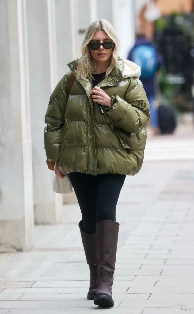 Mollie King in an Olive Puffer Jacket