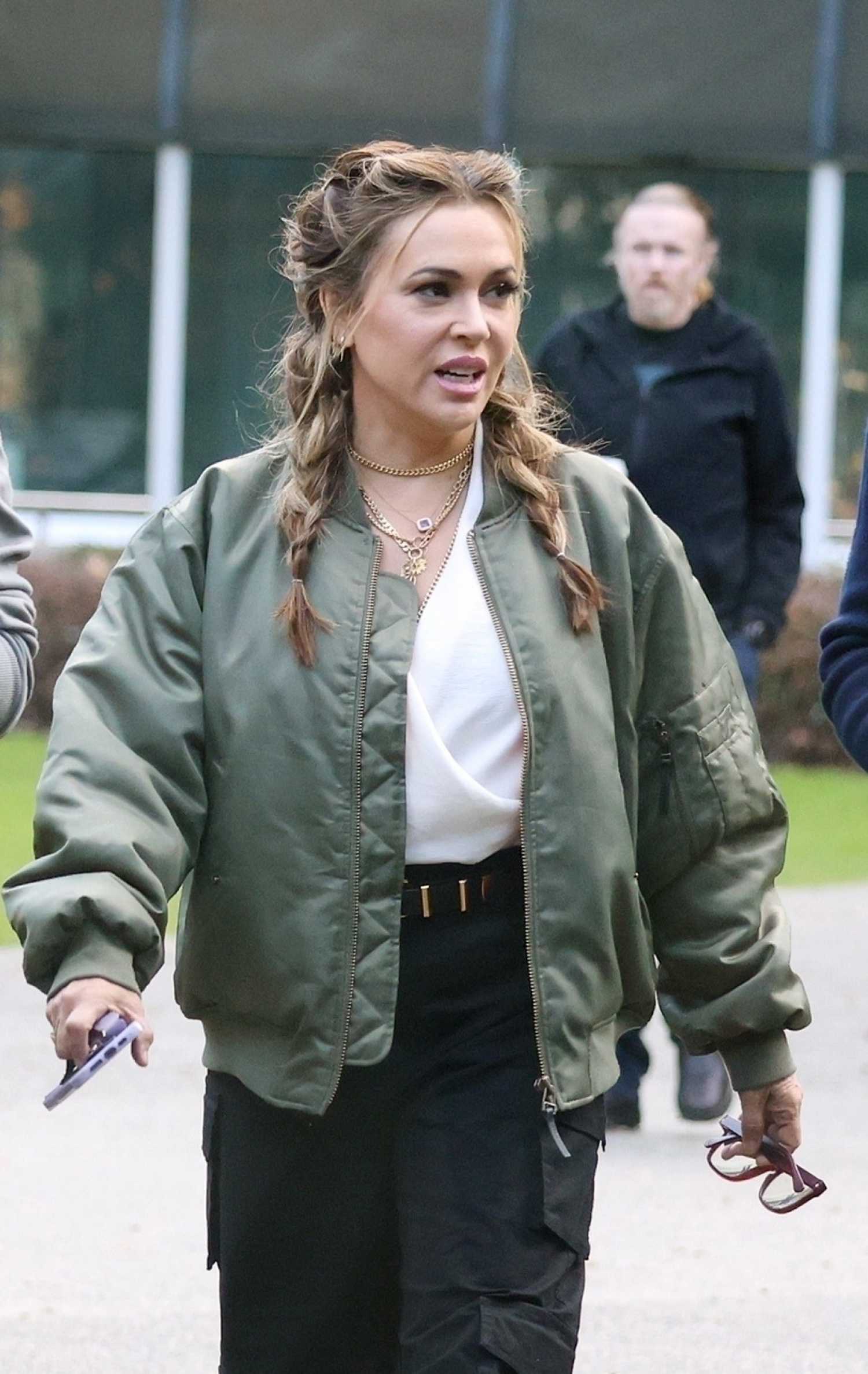 Alyssa Milano in an Olive Bomber Jacket Arrives at the Perth Convention