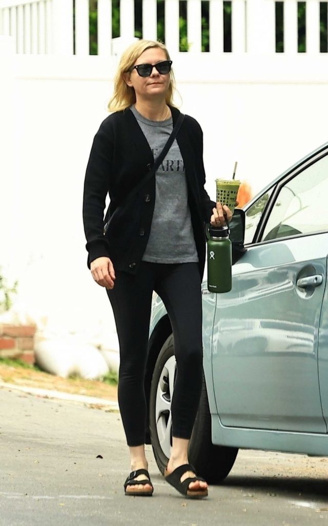 Kirsten Dunst in a Black Cardigan