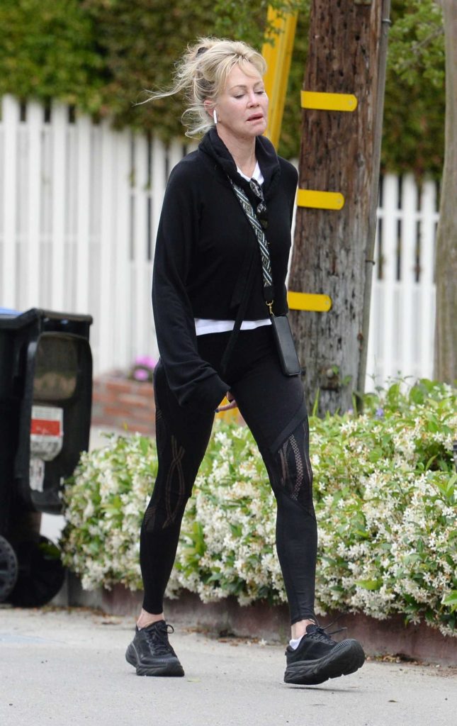 Melanie Griffith in a Black Outfit
