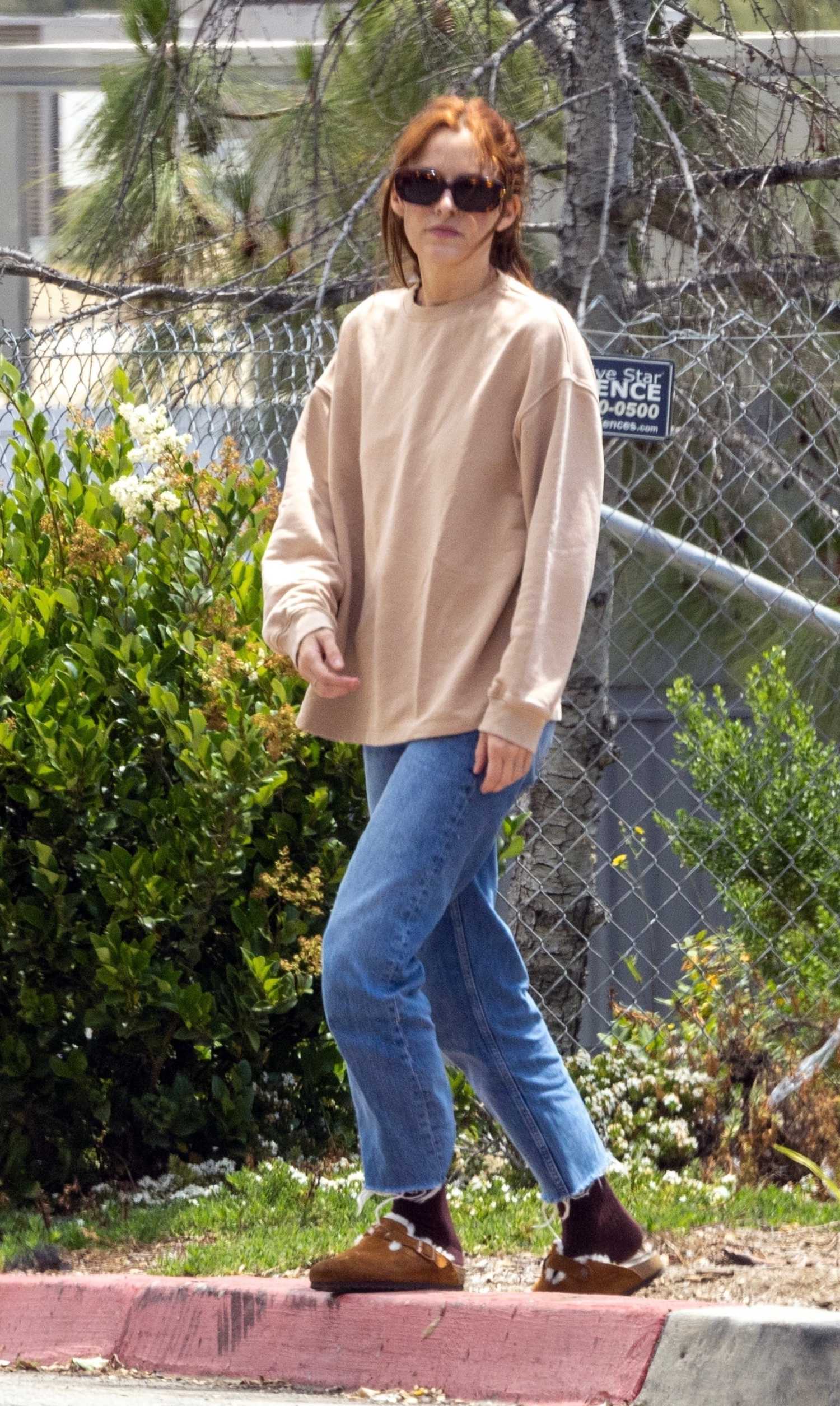 Riley Keough in a Beige Sweatshirt Arrives at Erewhon Market in Los