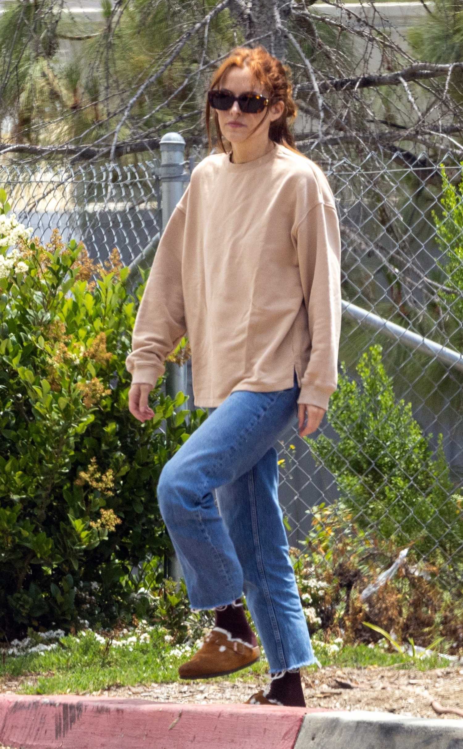 Riley Keough in a Beige Sweatshirt Arrives at Erewhon Market in Los