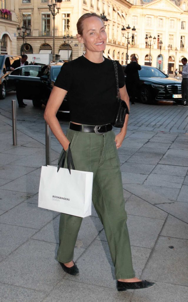 Amber Valletta in an Olive Pants