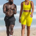 Eniko Parrish in a Yellow Workout Ensemble Was Seen Out with Kevin Hart on the Beach of Costa Rica