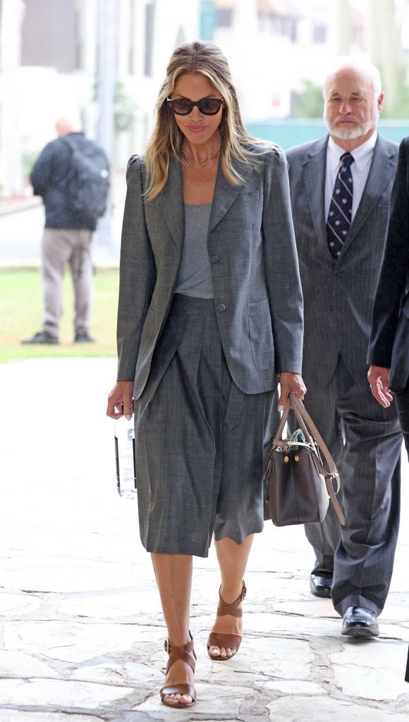 Christine Baumgartner in a Grey Suit
