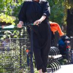 Deborra-Lee Furness in a Black Outfit Riding an Electric Scooter Around New York City