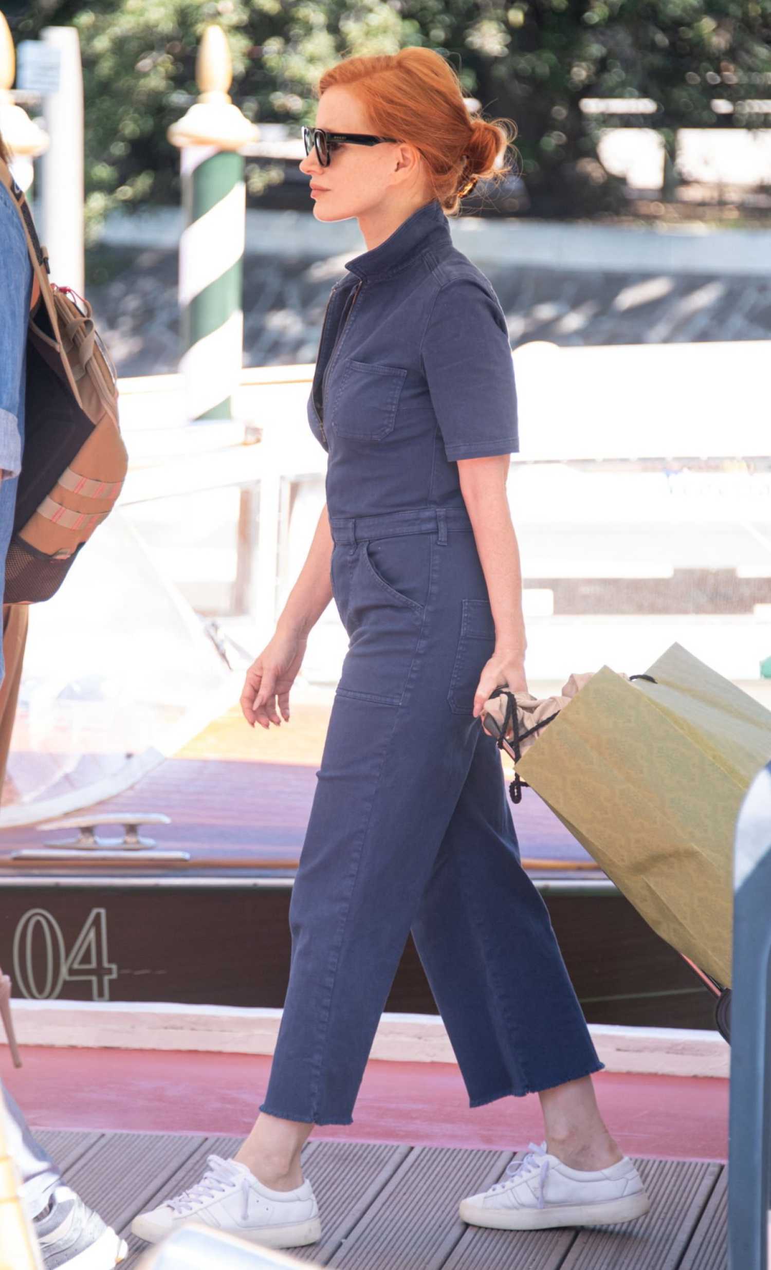 Jessica Chastain in a Denim Jumpsuit Leaves the Hotel Excelsior During