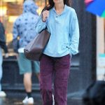 Katie Holmes in a Blue Shirt Was Spotted on a Rainy Day in Soho in New York