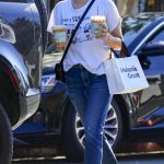Emma Roberts in a White Tee Was Spotted at trendy Melrose Place in Los Angeles
