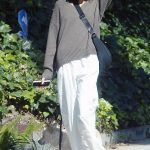 Kaia Gerber in a White Pants Walks Her Dog in Los Angeles
