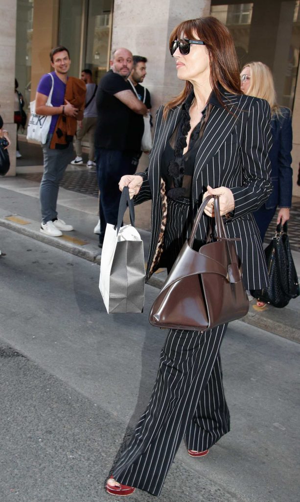 Monica Bellucci in a Black Striped Pantsuit