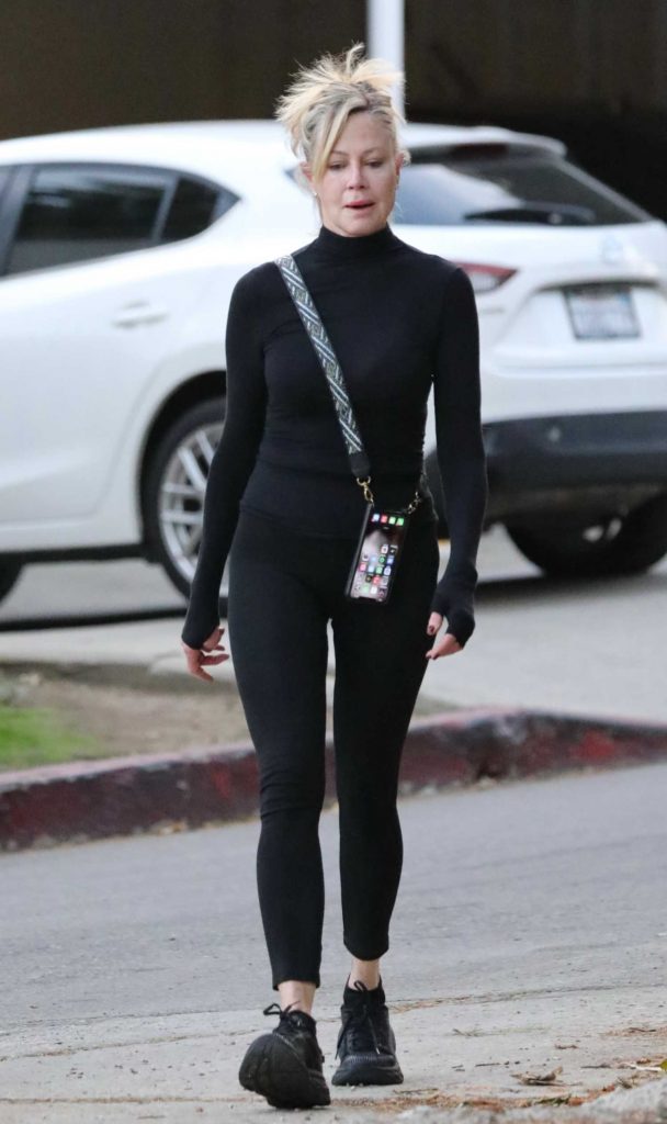 Melanie Griffith in a Black Outfit