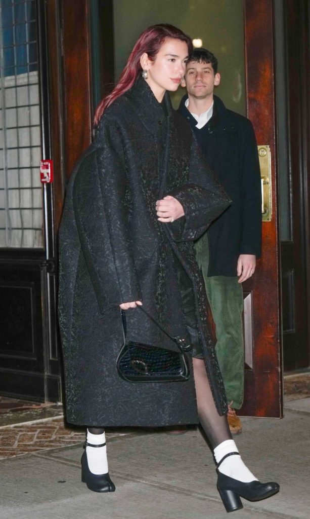 Dua Lipa in a Black Coat