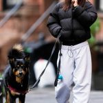 Emily Ratajkowski in a Red Beanie Hat Walks Her Dog in New York