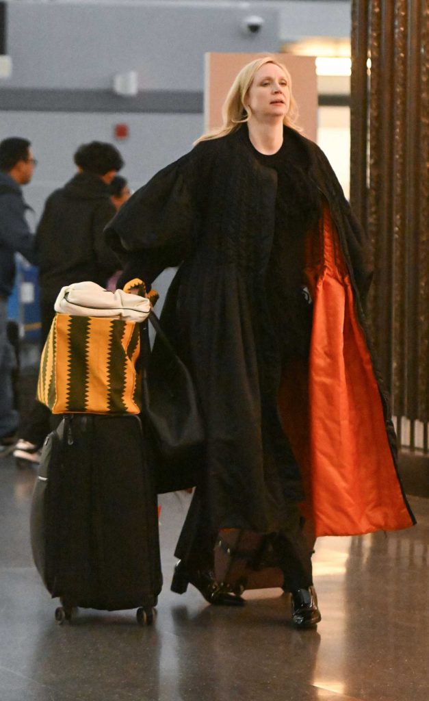 Gwendoline Christie in a Black Coat