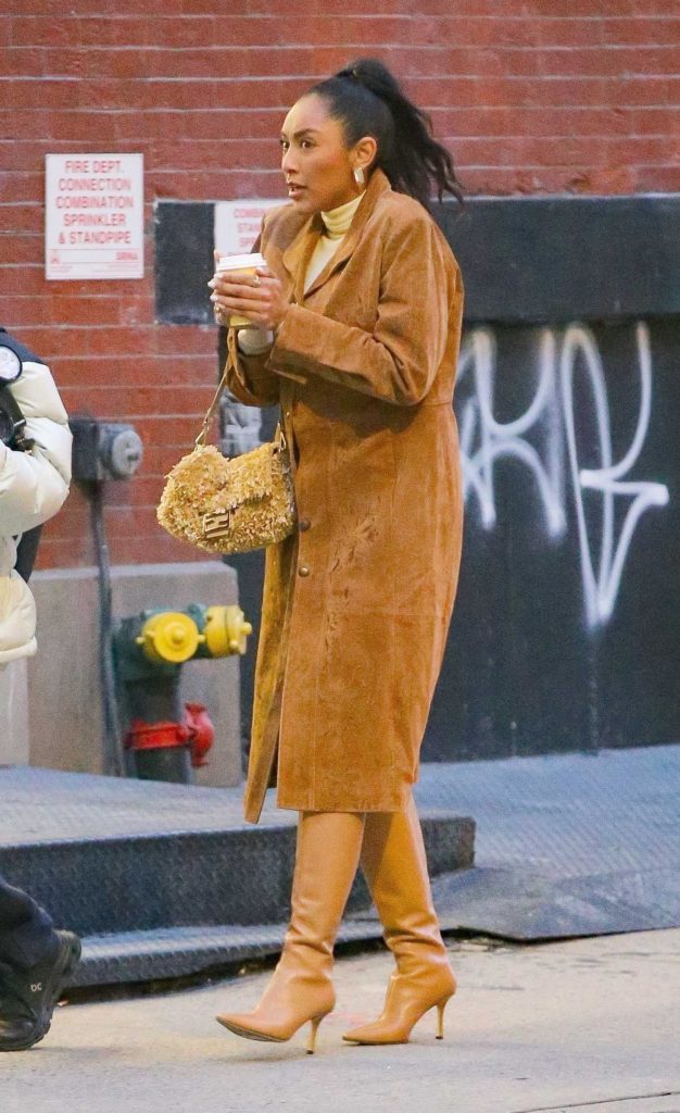Tayshia Adams in a Light Brown Leather Trench Coat