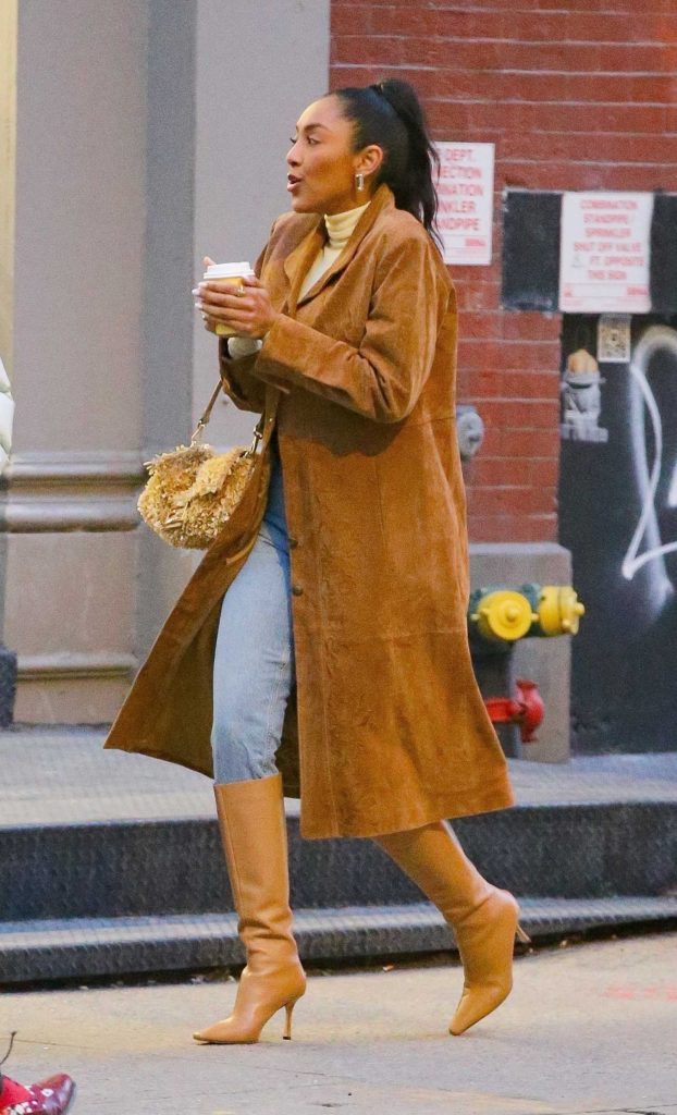 Tayshia Adams in a Light Brown Leather Trench Coat