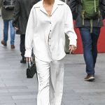 Ashley Roberts in a White Pantsuit Leaves the Heart Breakfast in London