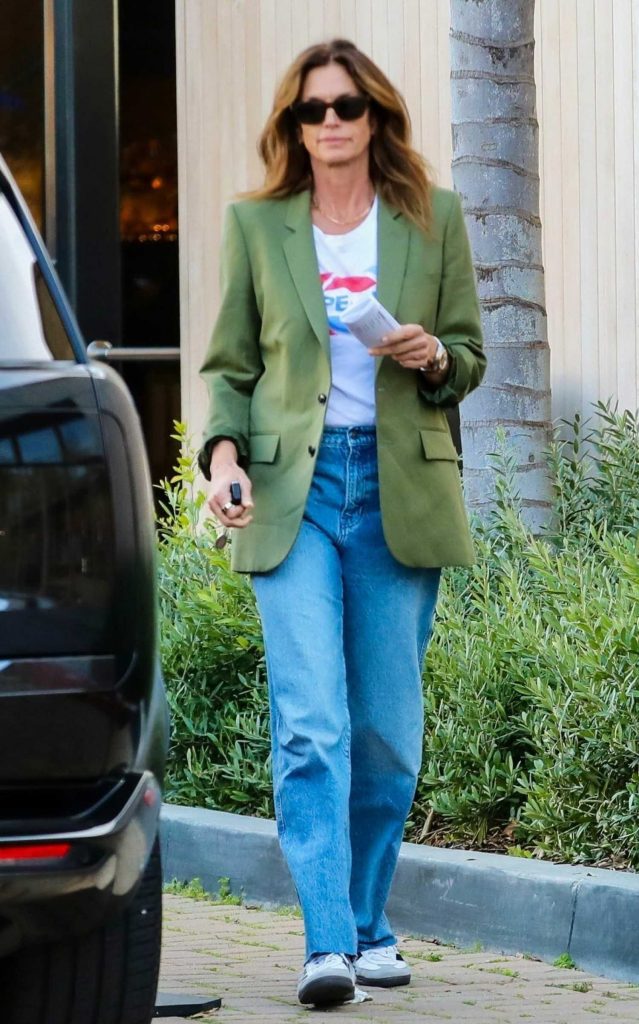 Cindy Crawford in an Olive Blazer