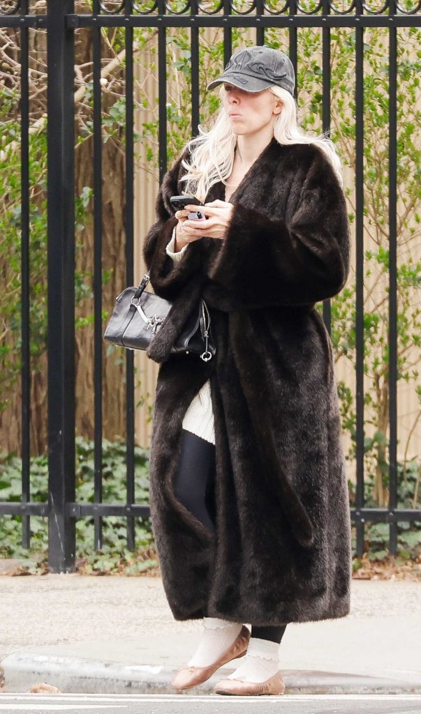 Julia Fox in a Black Fur Coat