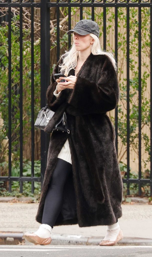Julia Fox in a Black Fur Coat