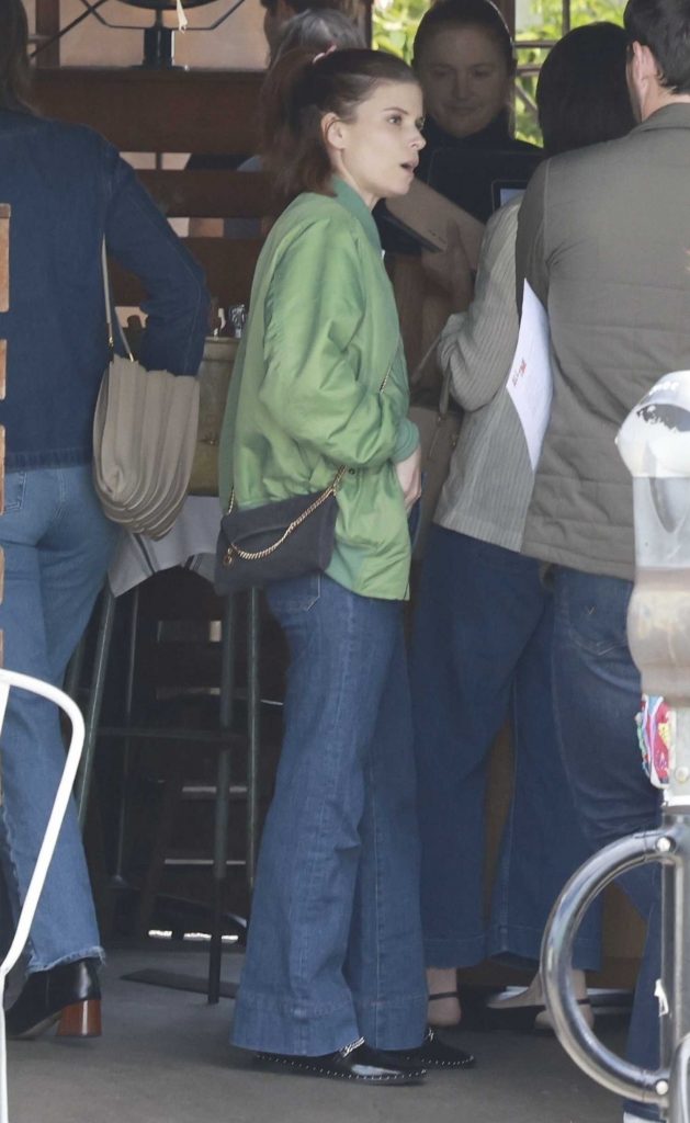 Kate Mara in a Green Jacket