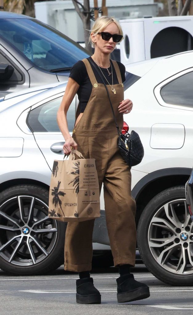 Kimberly Stewart in a Brown Jumpsuit