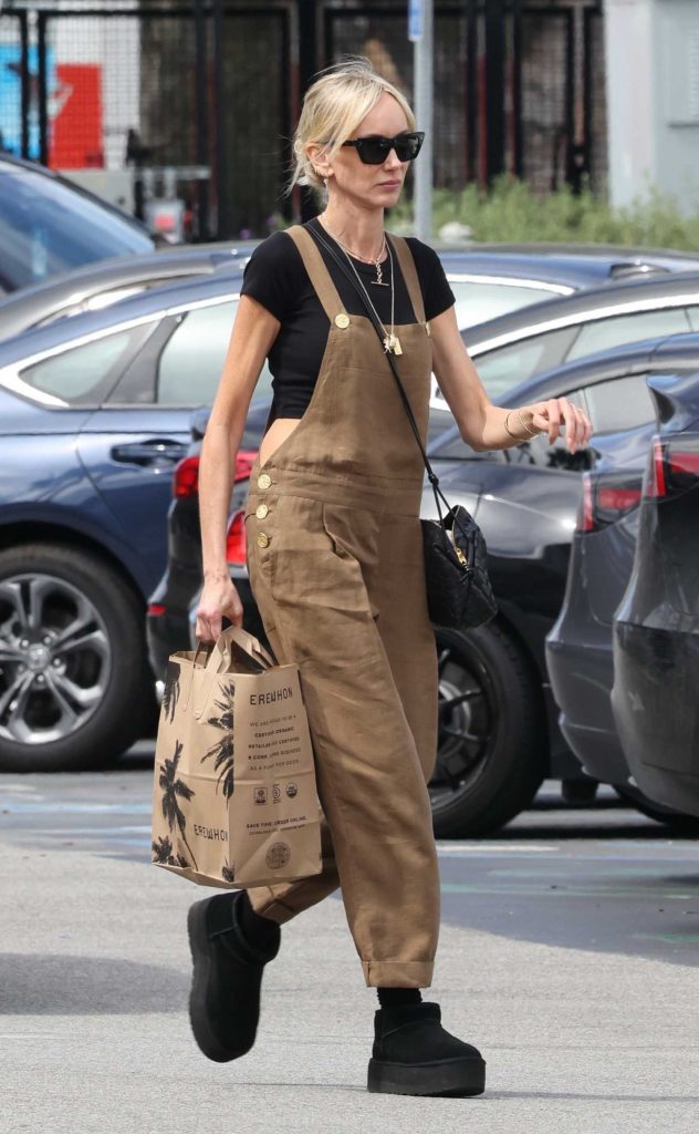 Kimberly Stewart in a Brown Jumpsuit