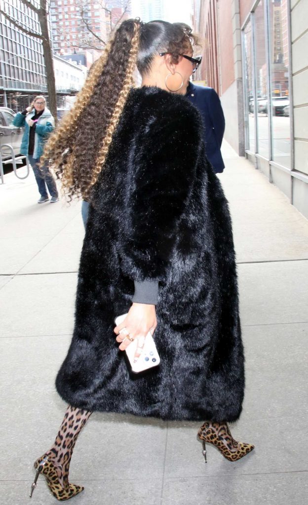 Melanie Brown in a Black Fur Coat