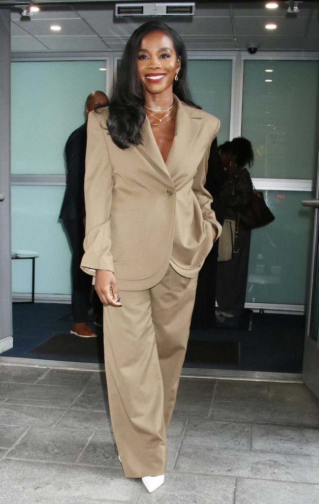 Deborah Ayorinde in a Beige Pantsuit