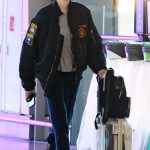 Cara Delevingne in a Black Bomber Jacket Was Spotted Departing Heathrow Airport in London