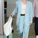 Elle Fanning in a Baby Blue Pantsuit Arrives at Nice Airport in Nice