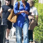 Laura Harrier in a Blue Shirt Walks Her Dog in Los Feliz