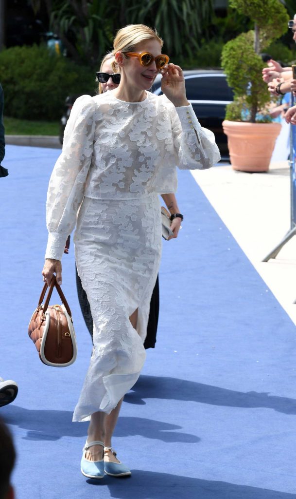 Kelly Rutherford in a White Lace Ensemble