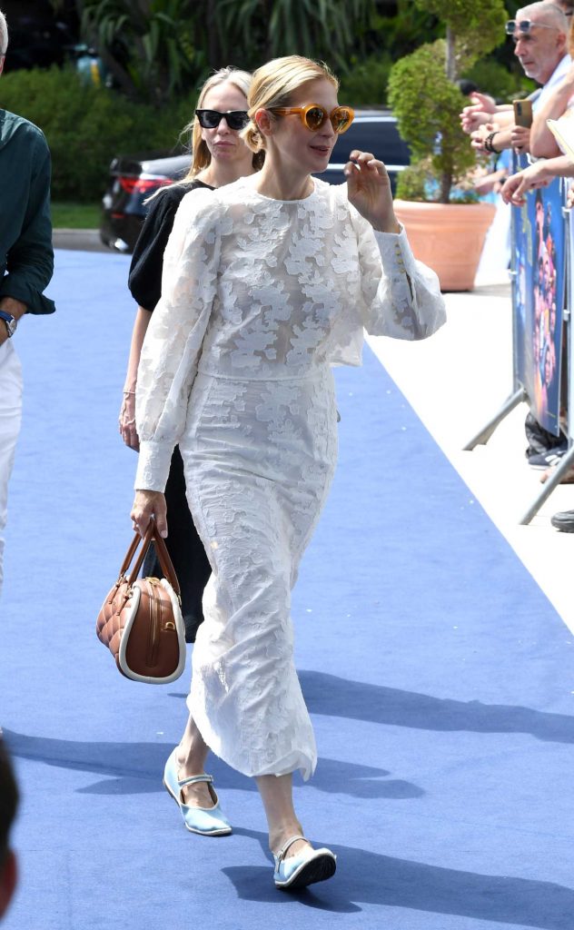 Kelly Rutherford in a White Lace Ensemble