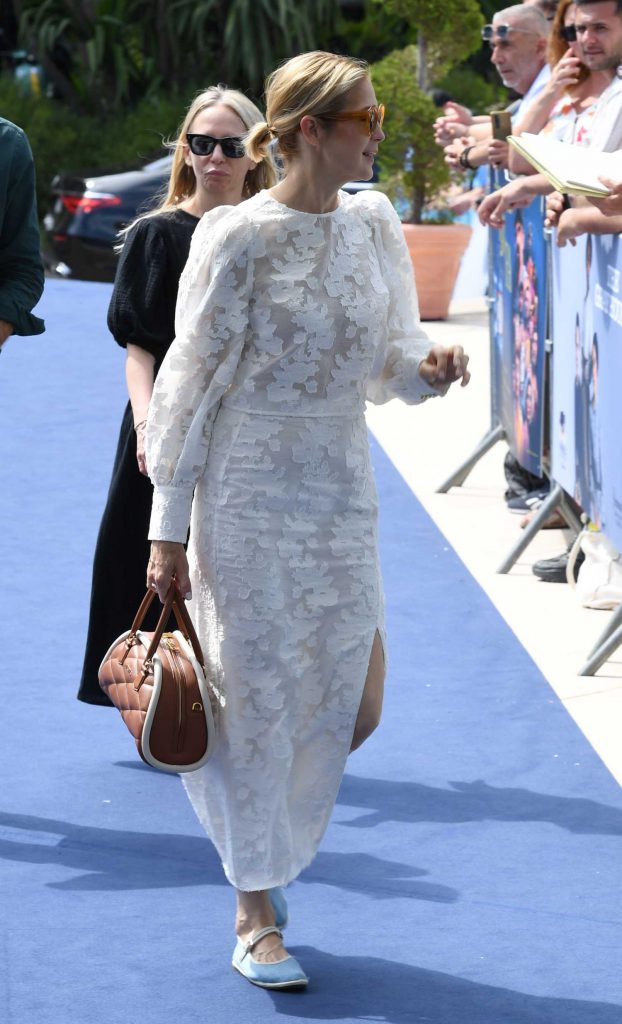 Kelly Rutherford in a White Lace Ensemble