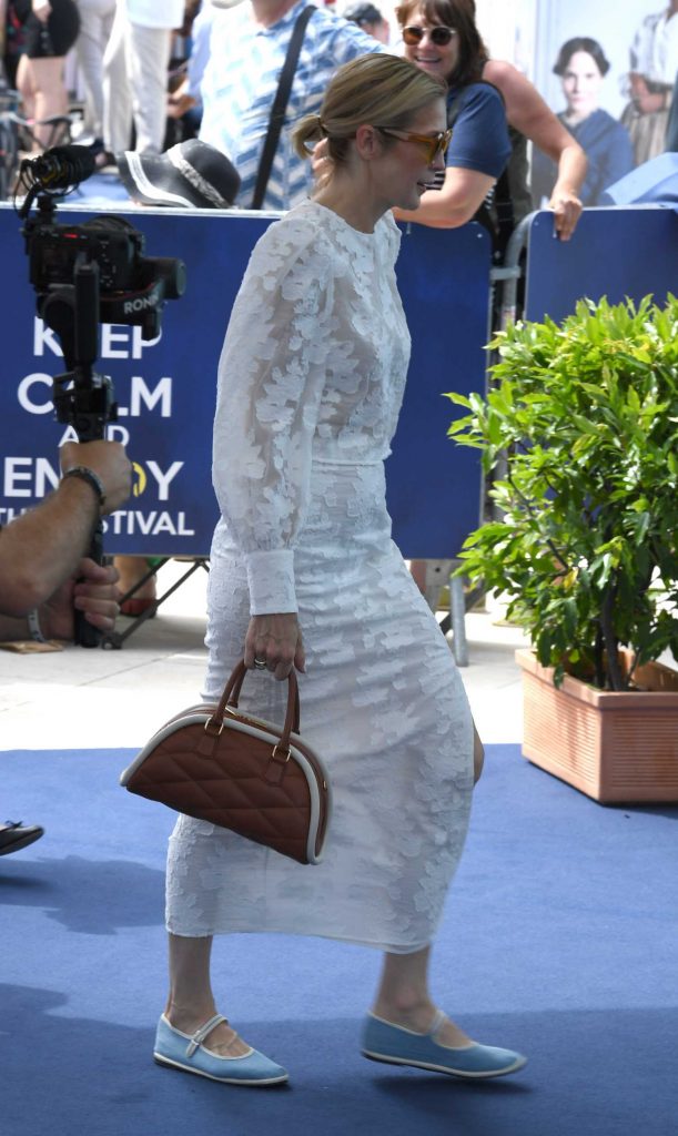 Kelly Rutherford in a White Lace Ensemble