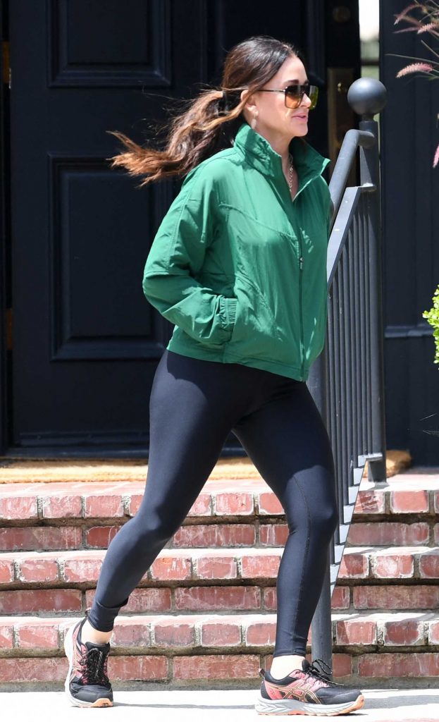 Kyle Richards in a Green Jacket