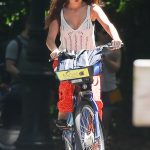Suri Cruise in a White Top Does a Bike Ride in Central Park in New York