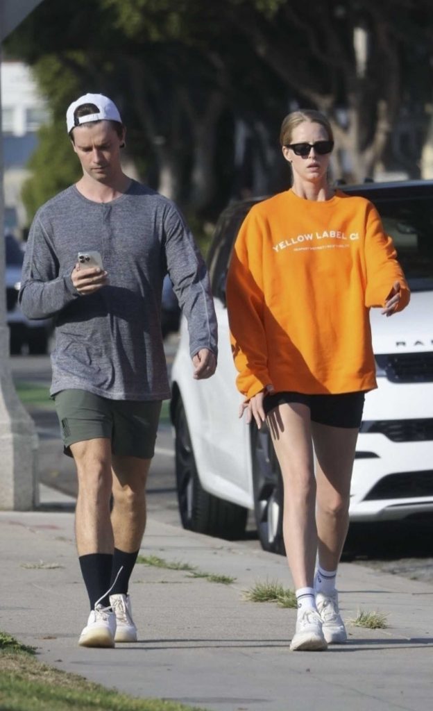 Abby Champion in an Orange Sweatshirt