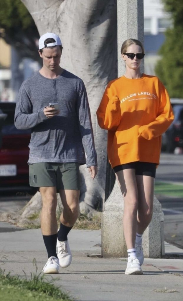 Abby Champion in an Orange Sweatshirt