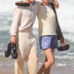 Emma Corrin in a Striped Shorts Was Spotted Out with Rami Malek on Ipanema Beach in Rio de Janeiro