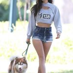 Ines Trocchia in a Daisy Duke Shorts Enjoys a Walk with Her Dog at a Park in a Beverly Hills