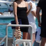 Natasha Poly in a Black Mini Dress Walks Along the Pier of the Club 55 in Saint Tropez