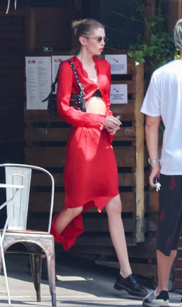 Stella Maxwell in a Red Satin Dress