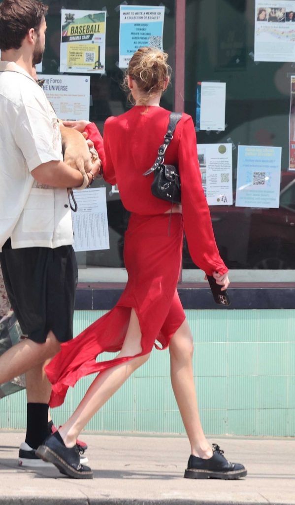 Stella Maxwell in a Red Satin Dress