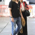 Zoe Saldana in a Black Pants Arrives at LAX Airport with Her Husband in Los Angeles